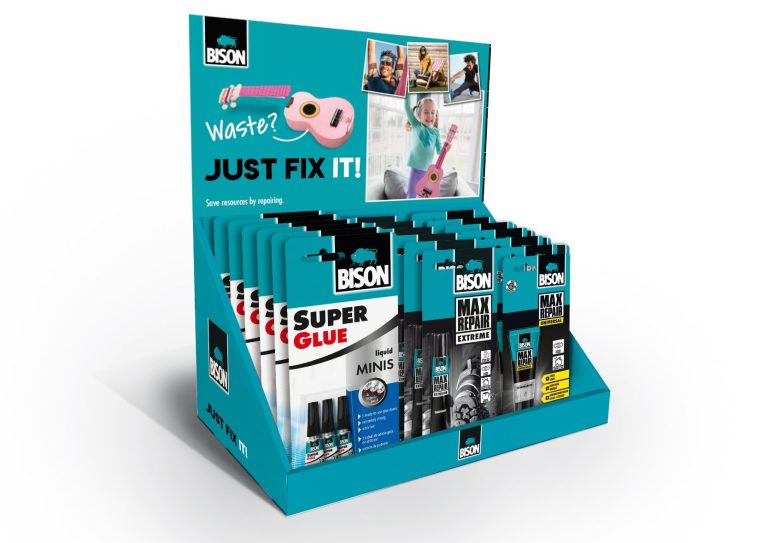 Text: Waste? Just Fix It! - Image of Bison Adhesive products on a counter top display stand